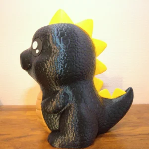 Lapsen säästöpossu dinosauruksen muoto.