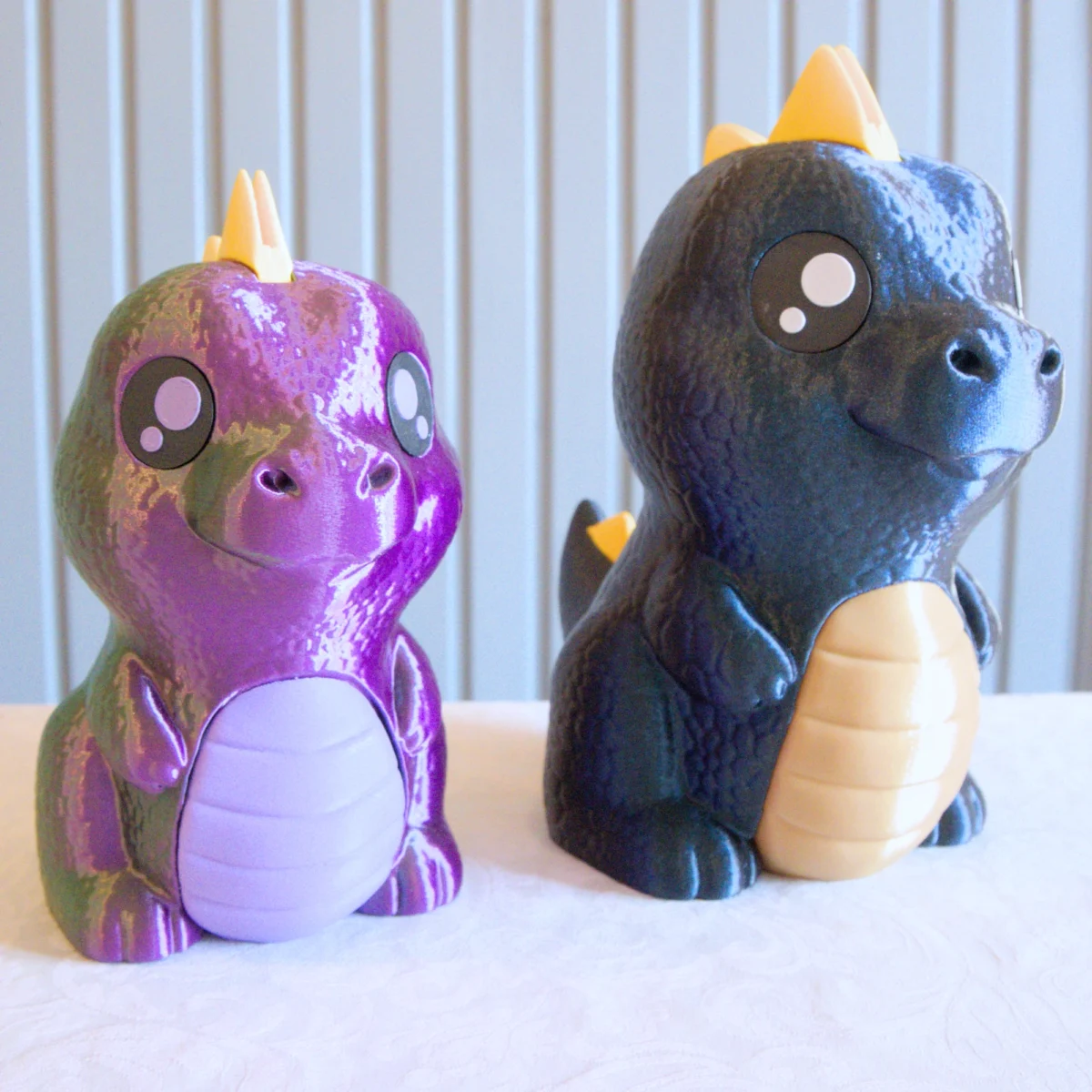 Kaksi dinosaurus säästöpossua